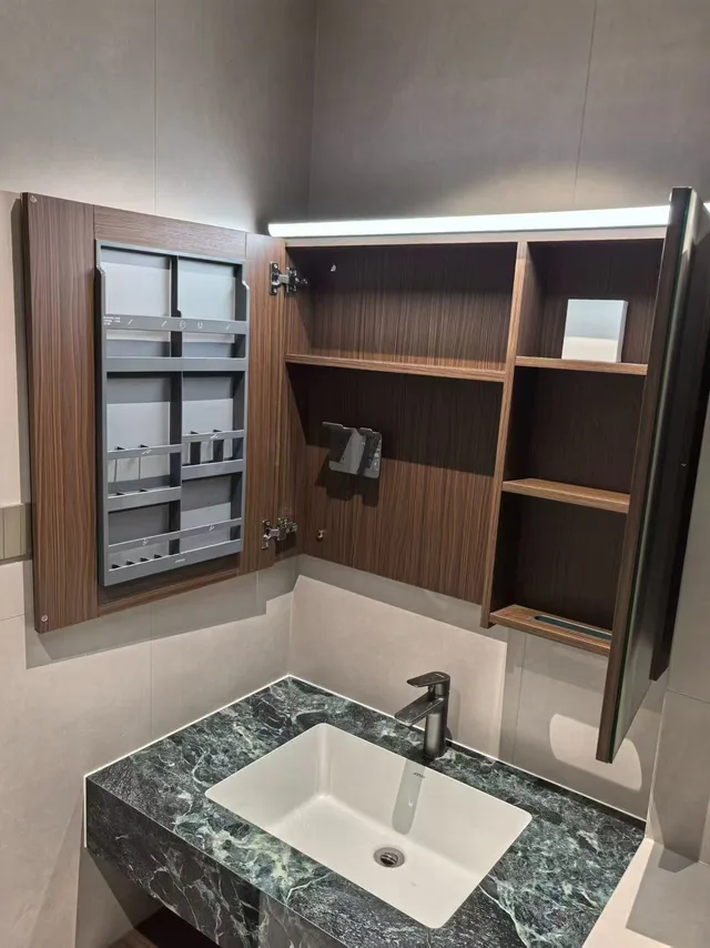 Open mirror cabinet above a rectangular bathroom basin