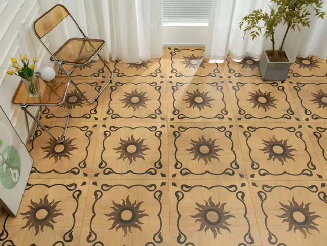 Decorative patterned floor beside two chairs and plants